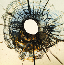 Bullet hole in glass