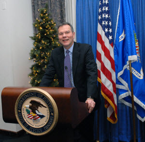 John Laub smiling at podium