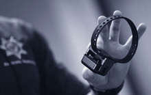 Officer holding a monitoring device