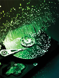 Computer hard disk with light pellets bouncing off of it.
