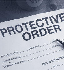 Pen resting on protective order form