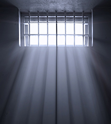 Light shining through jail cell window.
