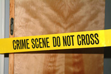 Photo of crime scene do not cross police tape across a door