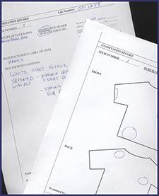 photo of pieces of paper that have drawing of front and back of tshirts on them