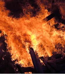 Image of flames engulfing building
