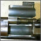 Blurry closeup photo of a firearm