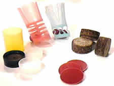 Shotshell wads and one-piece plastic wads