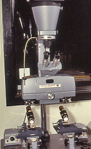 An American Optical comparison microscope with incandescent lighting and 4x5 format press camera