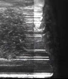 Land impression striations from a 9mm Luger caliber FMJ bullet fired from a Browning pisto