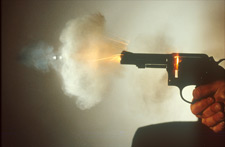 Cloud-like array of lead residues leaving the muzzle of a revolver
