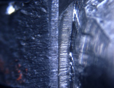 Microscopic comparison of evidence slice marks in bullet and known marks