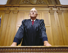 a judge peering down from his stand