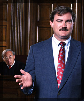 Photo of a prosecutor lawyer speaking in a front of a judge in court