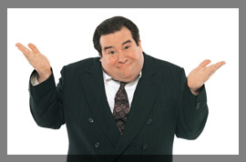 Photo of a male prosecutor shrugging his shoulders