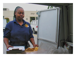 woman sorting evidence in the back of a truck