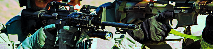 Military personnel with their rifles raised
