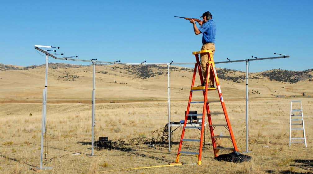  Exhibit 1. Marksman in position to perform shots with test recording. Note positions of microphones.