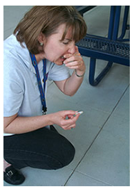 Photo of laboratory staff sneezing