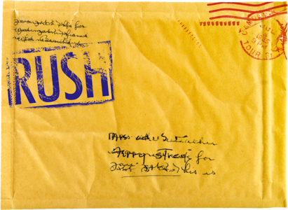 Yellow padded envelope with the word RUSH on it