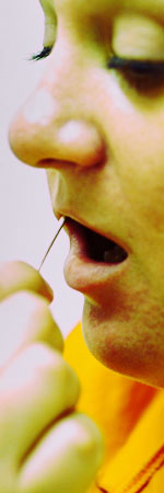 Photo of a woman getting her mouth swabbed