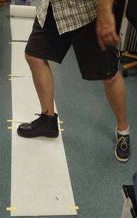 Researcher stepping on paper to knock off and collect loosely held from shoe